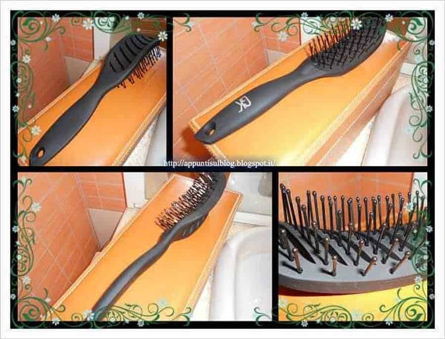 Pettine per capelli con punta arrotondata e denti in plastica nera, ideale per la cura dei capelli ricci e lisci decorato con motivi floreali e sfondo in mattonelle arancioni alto interesse SEO per cura capillare.