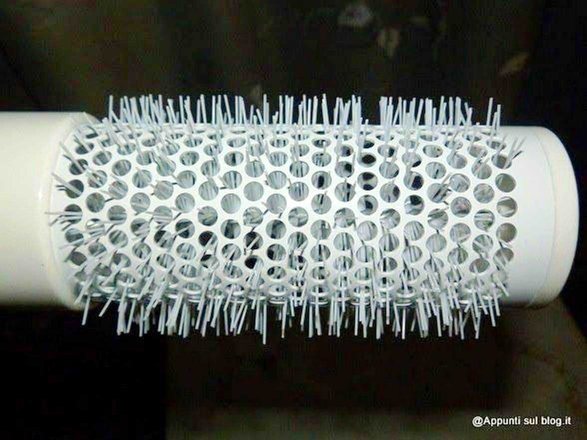Filamento di nastrino rotante per filare, con foro centrale e pin di collegamento, utilizzato in macchinari industriali e tessili.