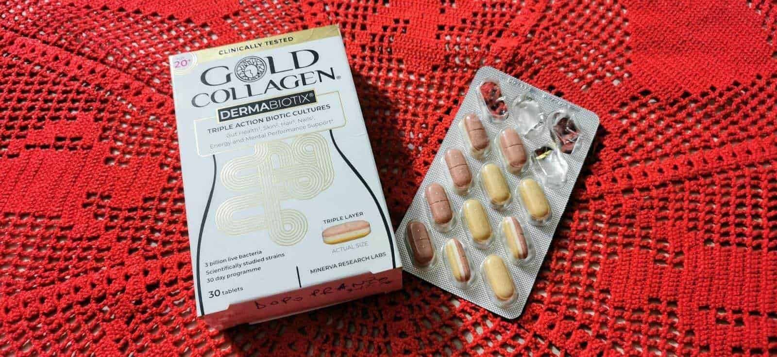 Gold Collagen Dermabiotix integratore alimentare con vitamine e probiotici, capsule per supporto immunitario e benessere della pelle, 30 compresse, prodotto naturale, foto su tavola rossa.
