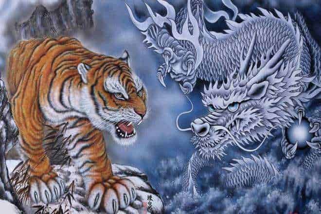 Feroce tigre e drago mitologico in un'arte fantasy con effetti di neve e nebbia; immagine simbolica di forza e mistero.