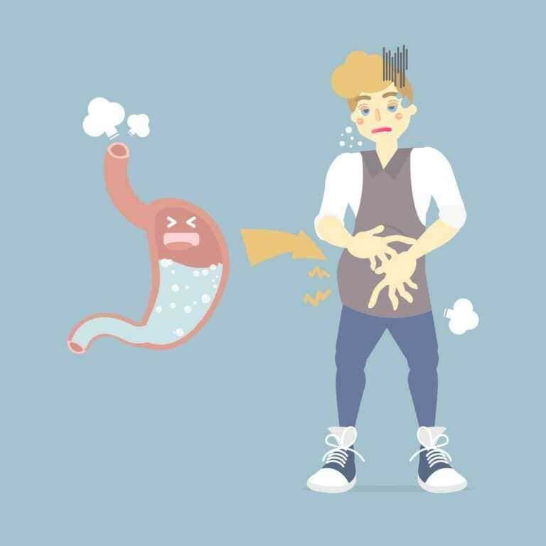 Dolore allo stomaco e indigestione, rappresentata da una persona infastidita che si tiene lo stomaco, con un'illustrazione di stomaco arrabbiato e aria nella pancia, sintomi di problemi gastrici.