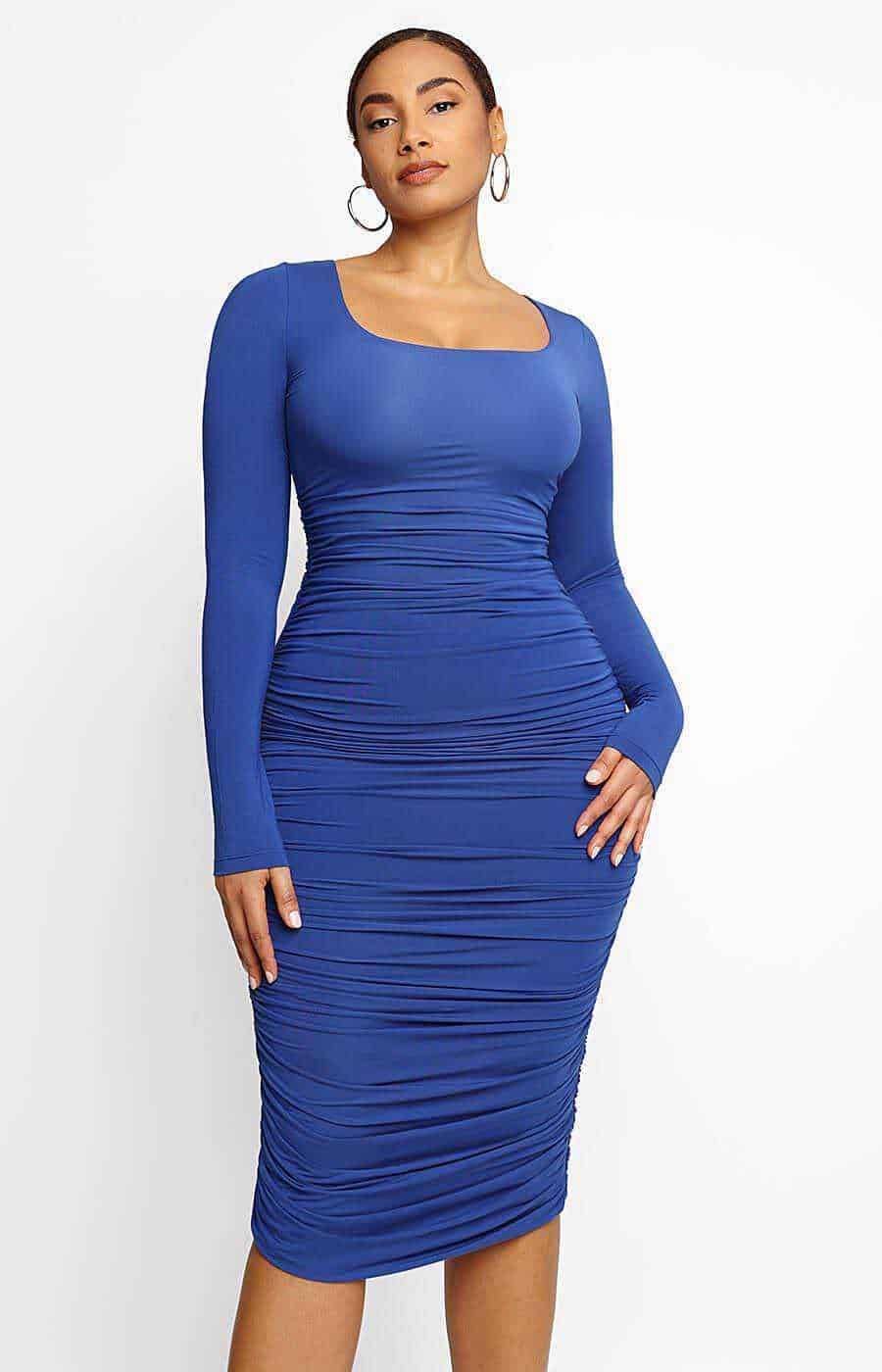 Shapewear dress for your individual style. Blue ruched bodycon dress with long sleeves and square neckline, elegant and fashionable.