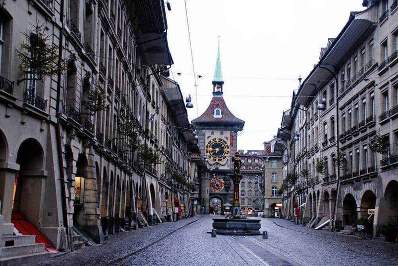 Zytglogge clock tower and Zahringer fountain on main street Kramgasse in Bern UNESCO World Heritage status.