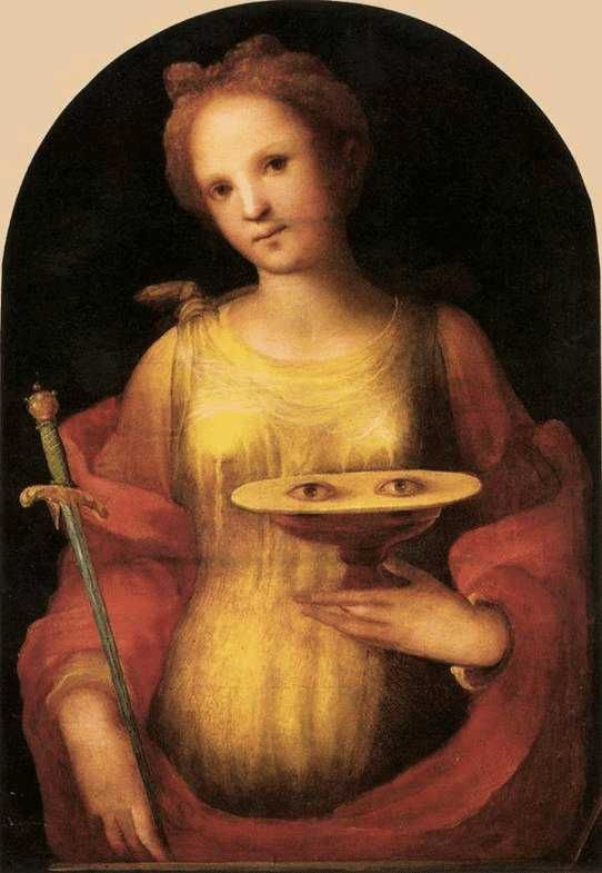 Santa Lucia martire di Siracusa: Storia, Simboli e Tradizioni (2026) 2 Santa lucia di siracusa: Suggestivo dipinto rinascimentale con figura femminile che tiene un piatto con occhi, simbolo di mistero e introspezione nell'arte storica.