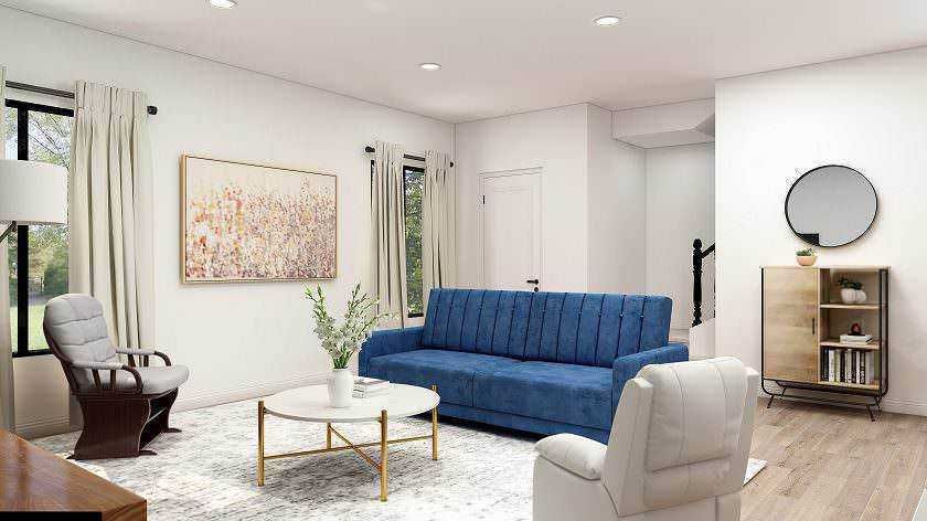 Comfortable soggiorno moderno con divano blu, poltrona in tessuto chiaro, tavolino centrale e decorazioni eleganti, alimentato da luce naturale, ideale per relax e socializzazione.