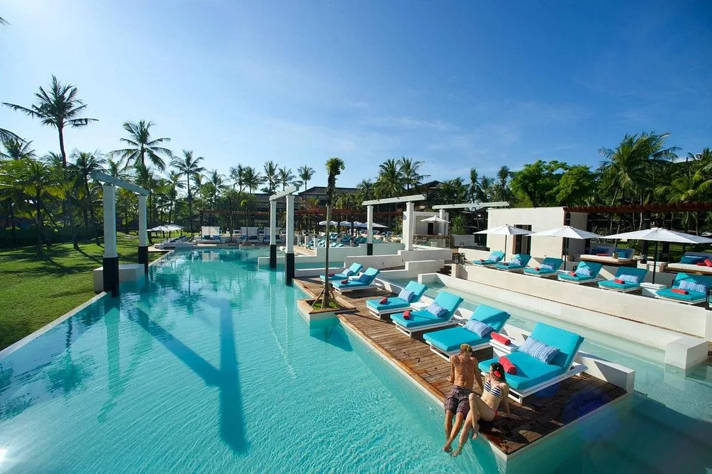 lounge chairs in resort pool