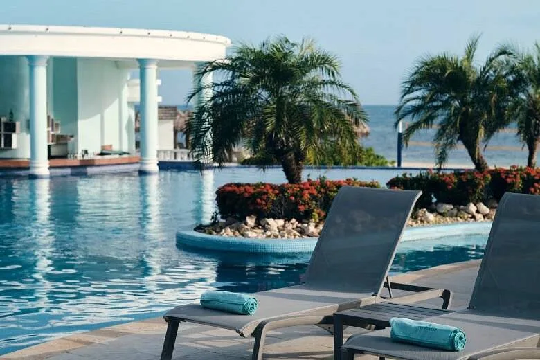 lounge chairs in front of resort pool