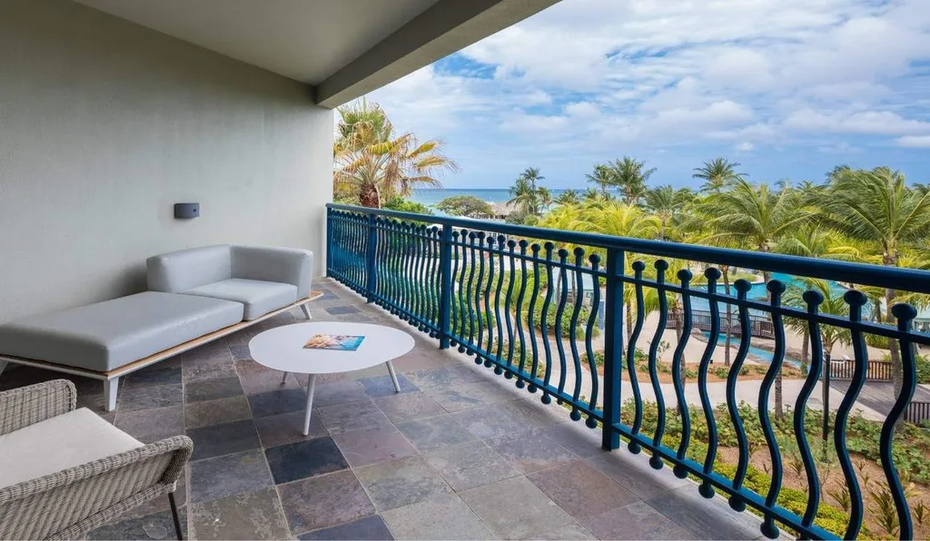 balcony of resort overlooking pool and ocean