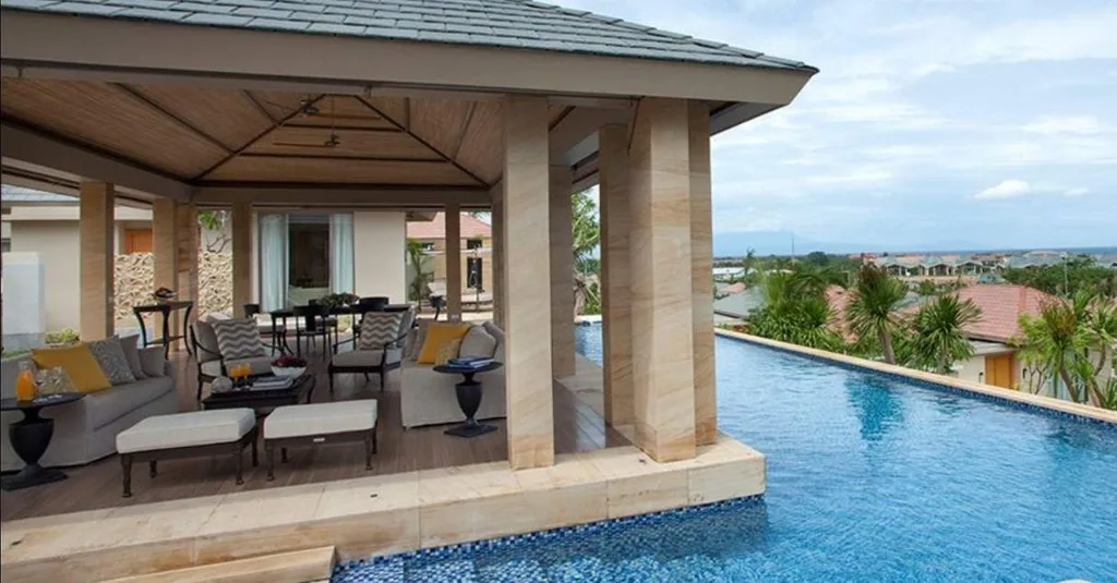 villa with porch and pool surrounding porch