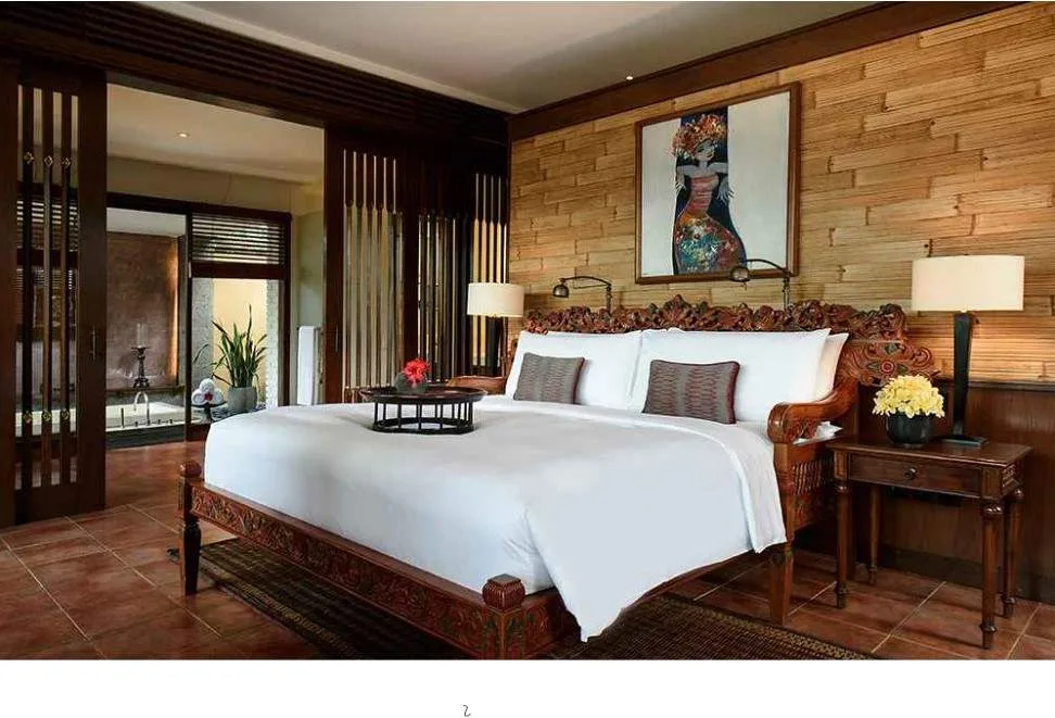 large resort bed with brown furniture