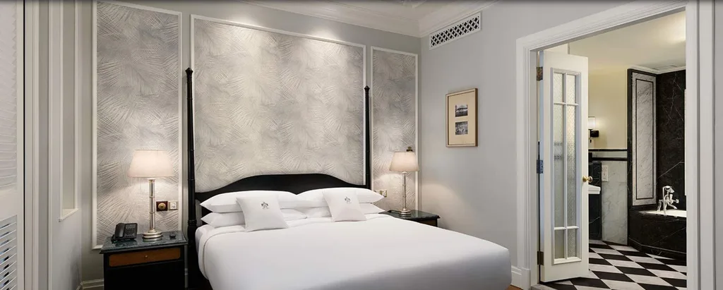 white bed with white walls