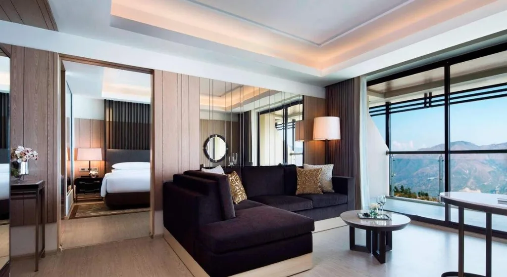 two brown couches in front of large window