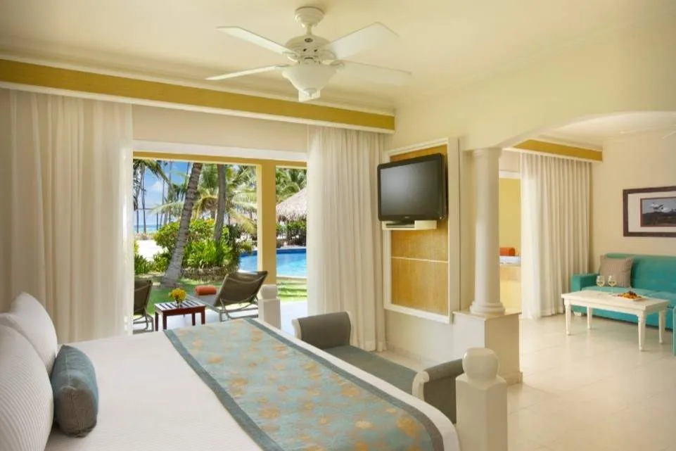 bed with open wall to pool