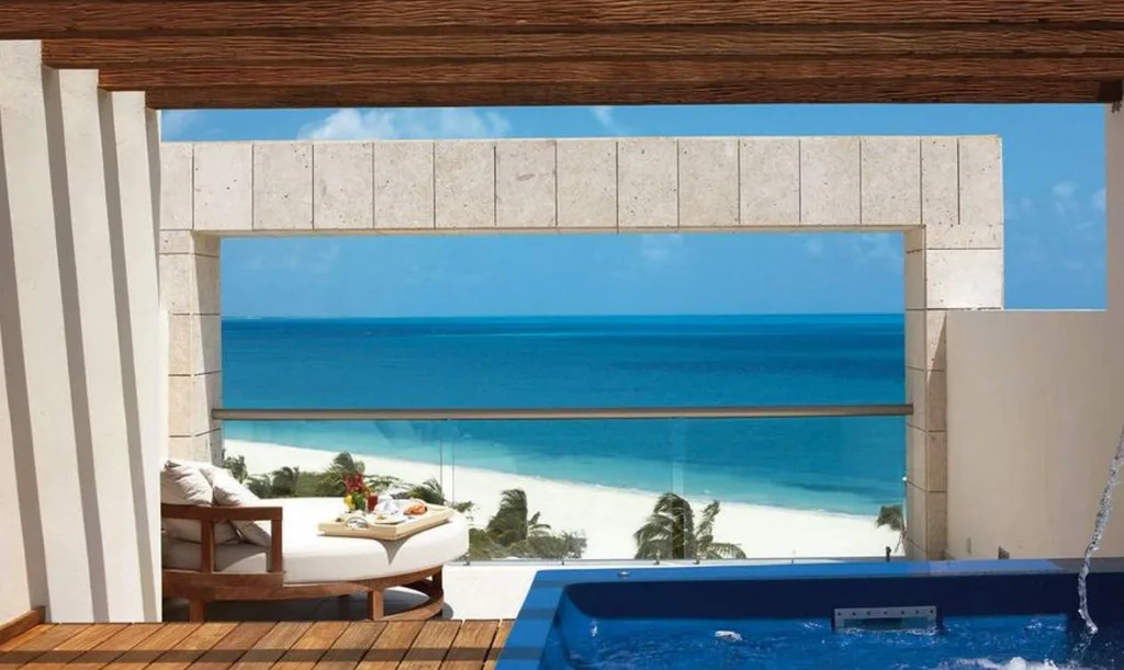 hot tub, table overlooking white sand beach