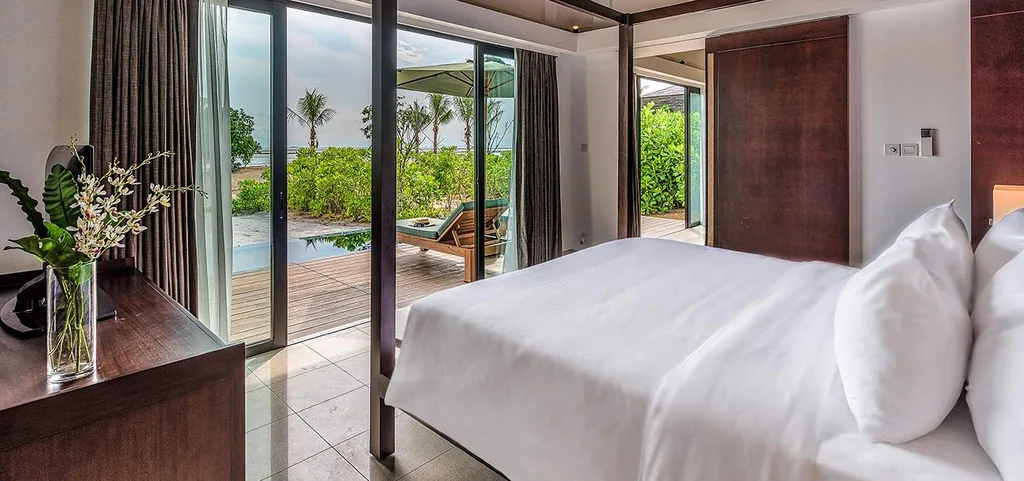 white bed look out at forest