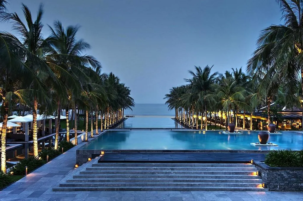 resort infinity pool lined by palm trees