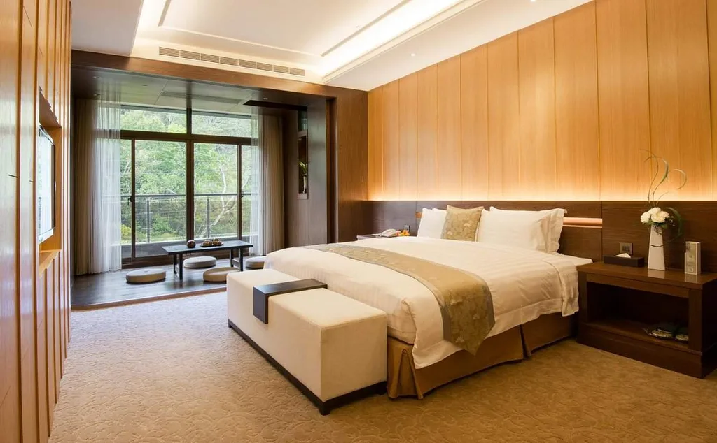 large resort room with tan walls and large bed