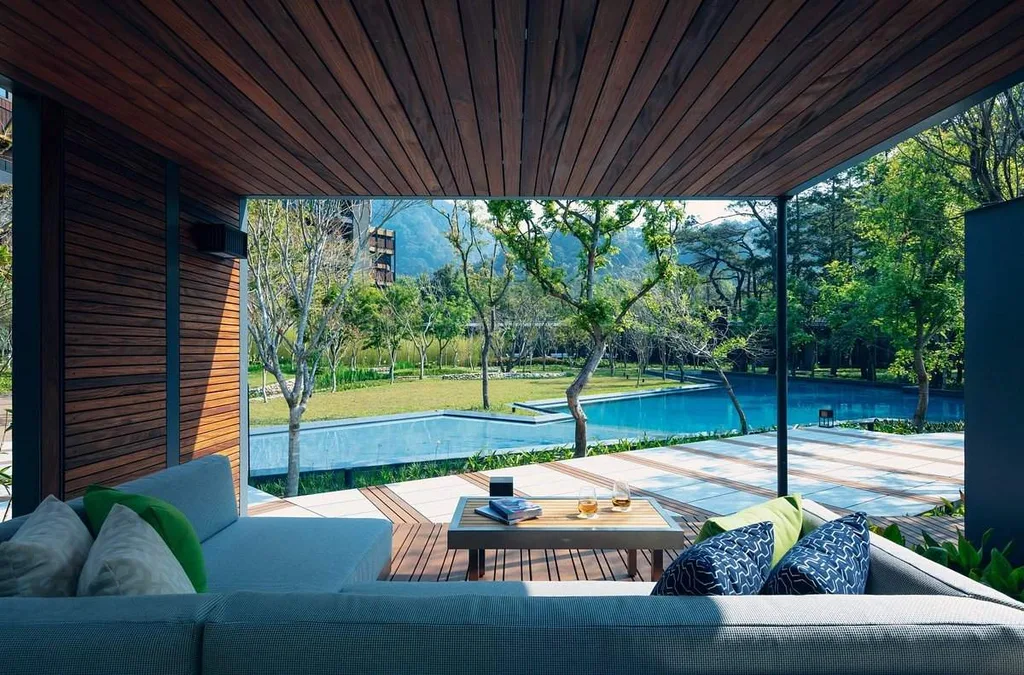 covered resort patio in front of square pool