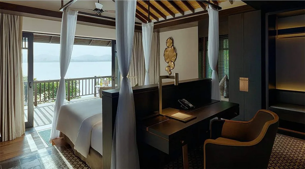 resort room with brown chair in front of table