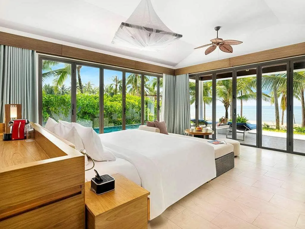 large resort room with windows on all sides