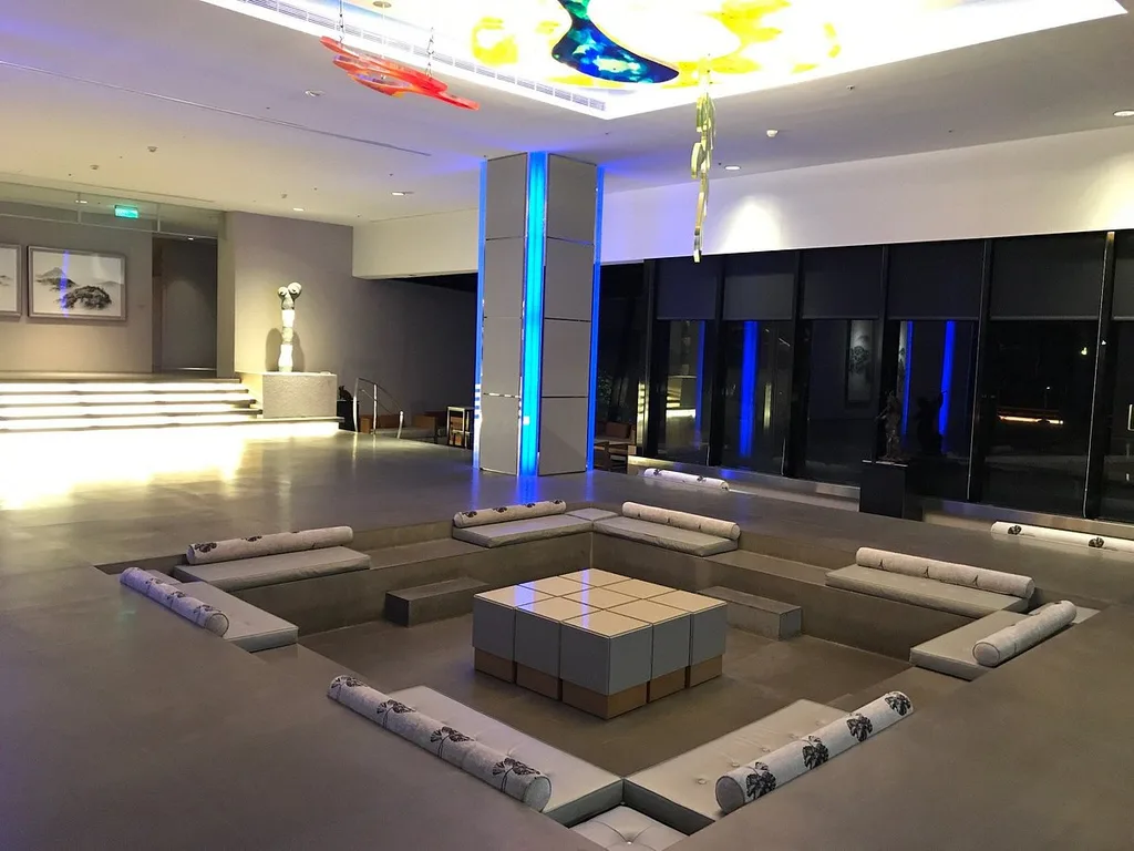 square seating area with lighted square pillar in the middle