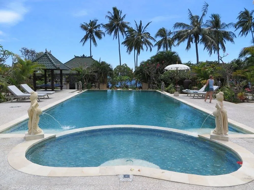 large pool attached to hot tub in the tropics