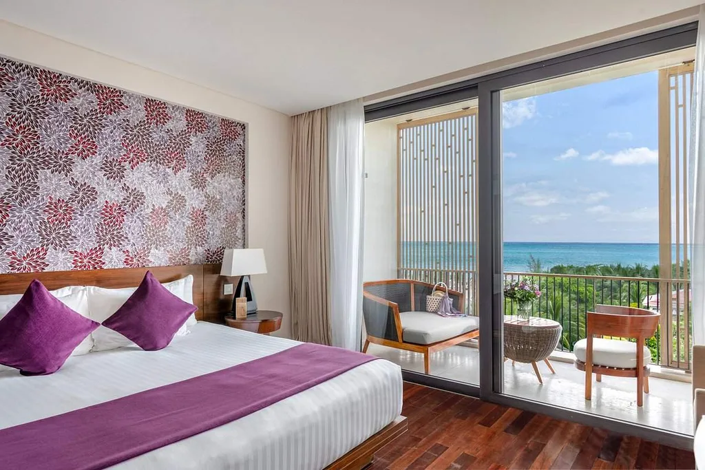 resort bed with floor to ceiling window on the right
