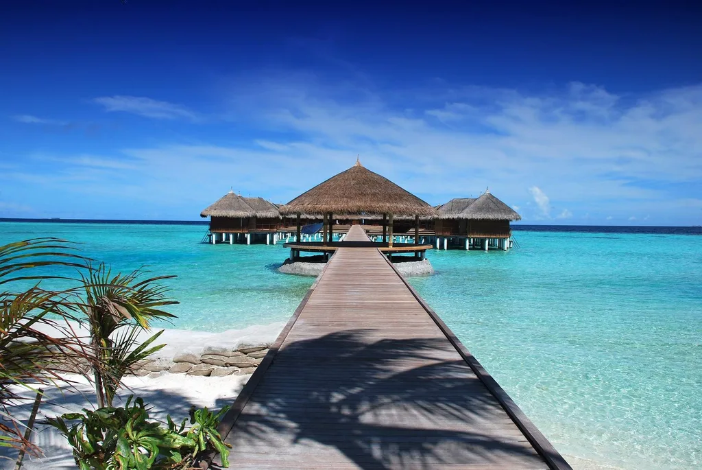 walkway leading to 3 bungalows over water