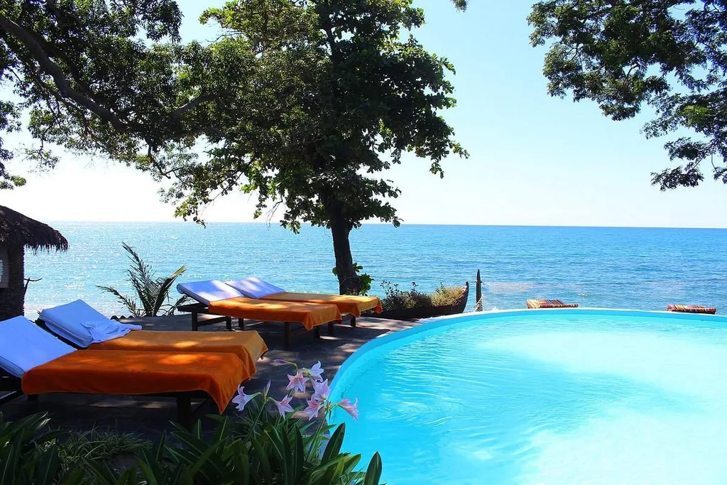 lounge chairs around circular infinity pool