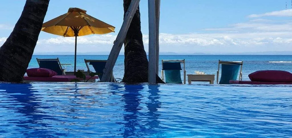infinity pool in front of ocean