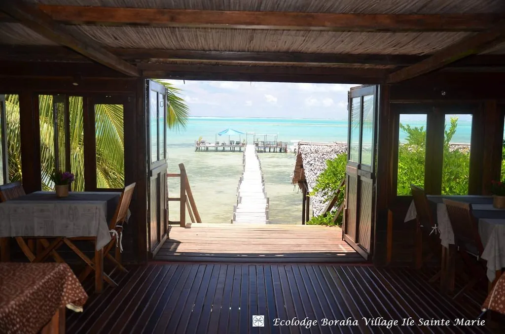 inside restaurant looking out onto walkway over the ocean
