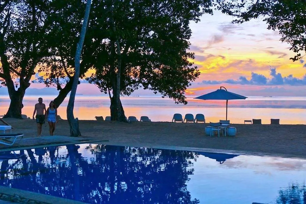 pool in front of ocean at sunset