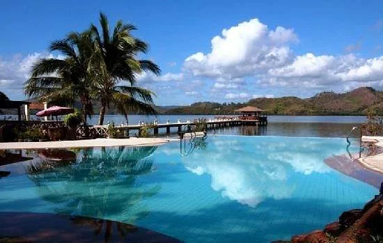 walking bridge next to large infinity pool