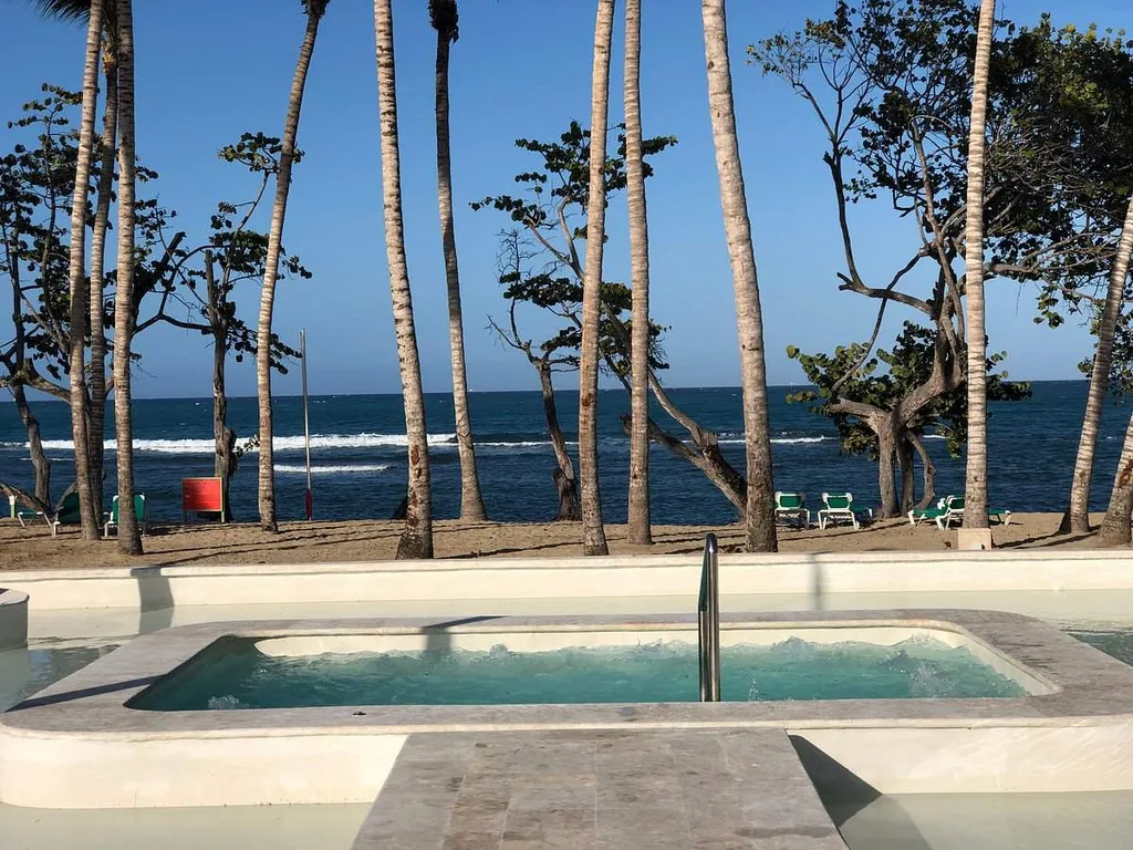 square resort pool in front of ocean