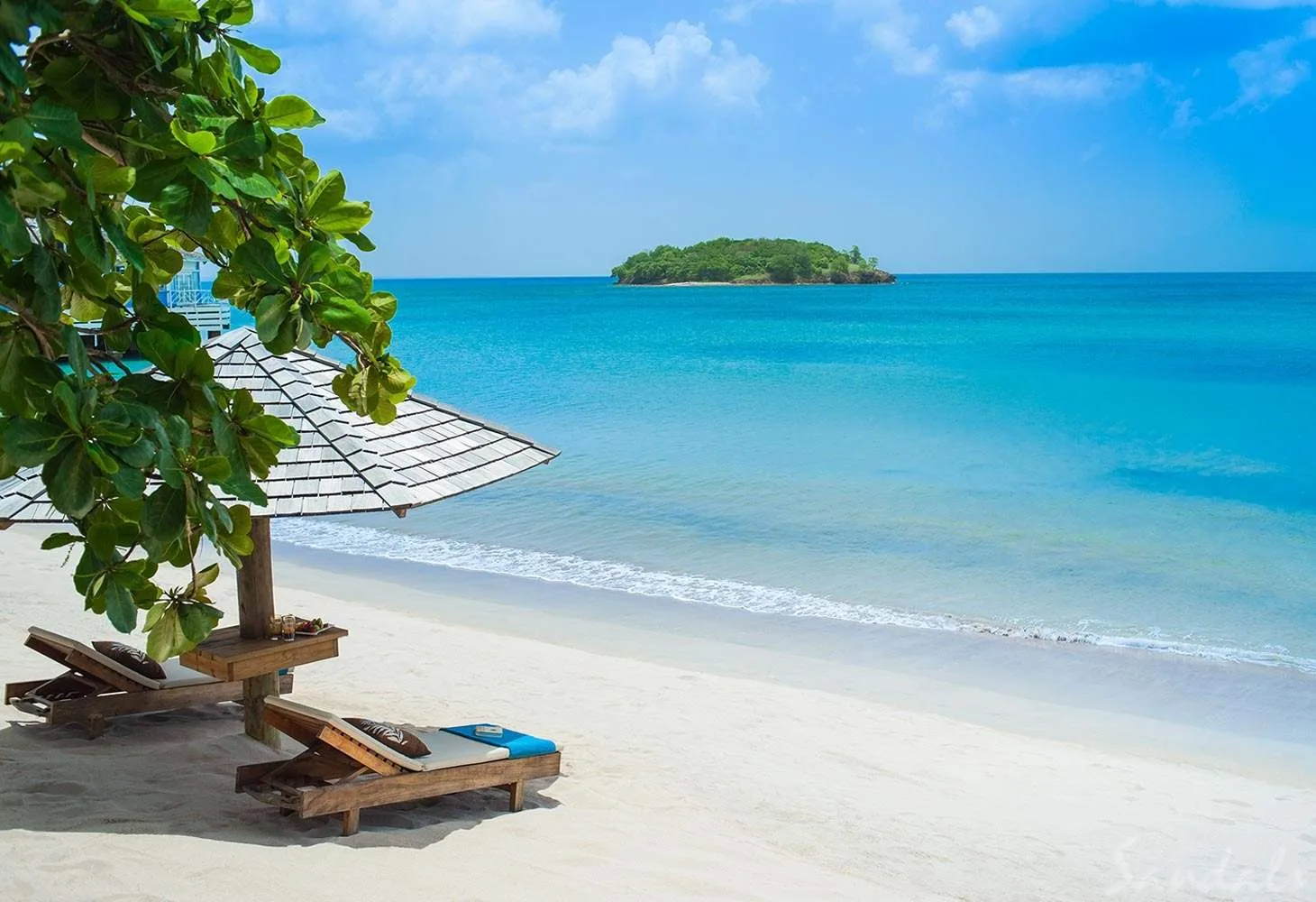 two lounge chairs on beach