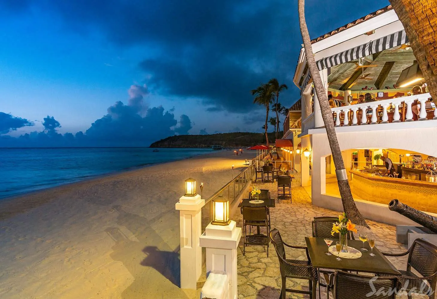 tables on beach at night