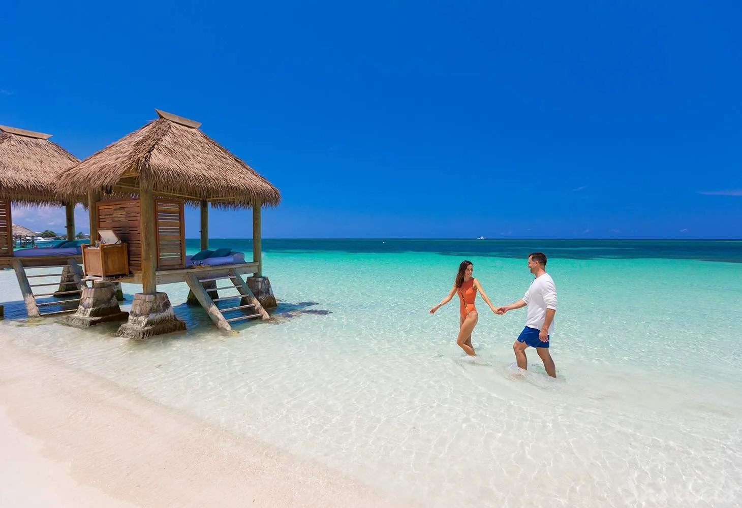 couple coming out of water