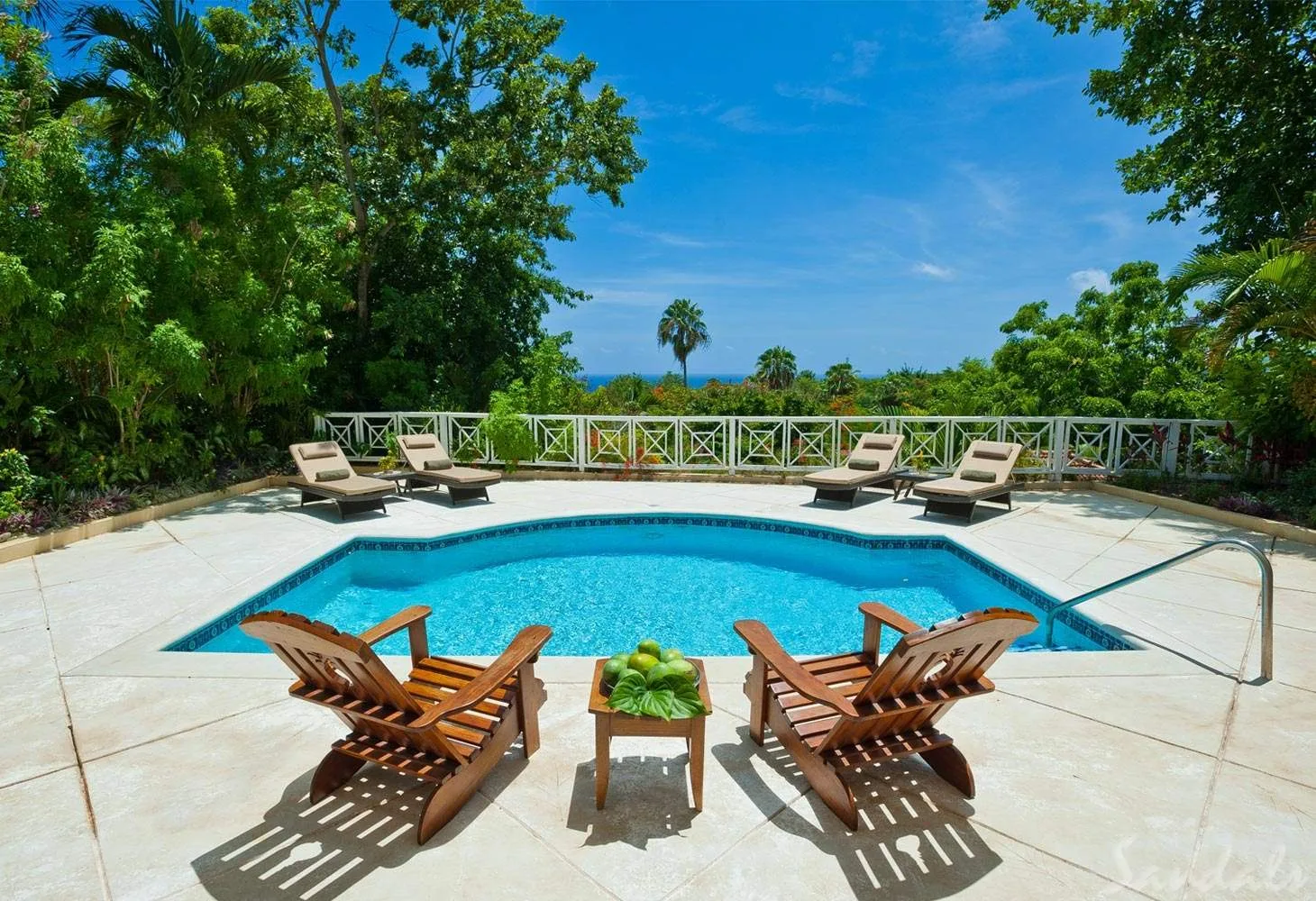 two chairs in front of pool at resort