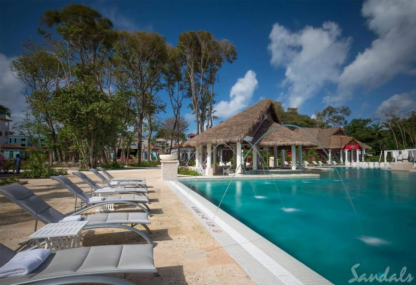 lounge chairs surrounding square pool
