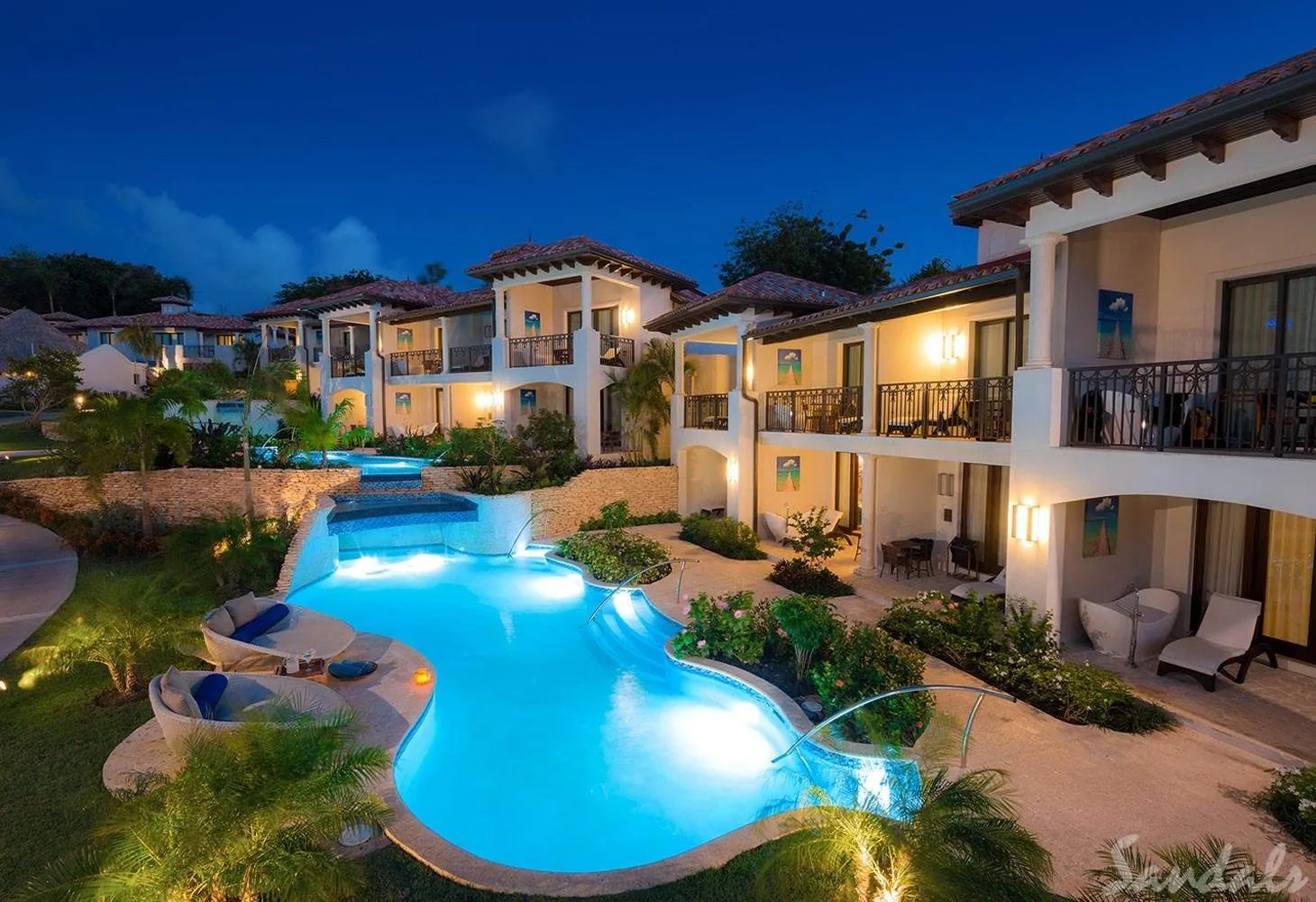 resort with lighted pool at night