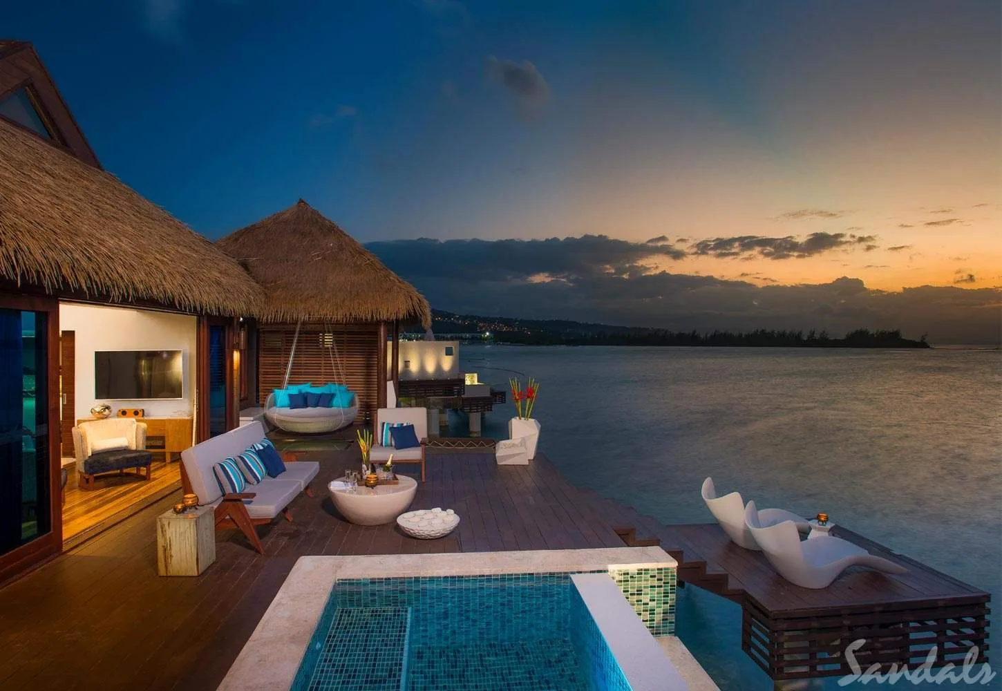 over-water bungalow at sunset