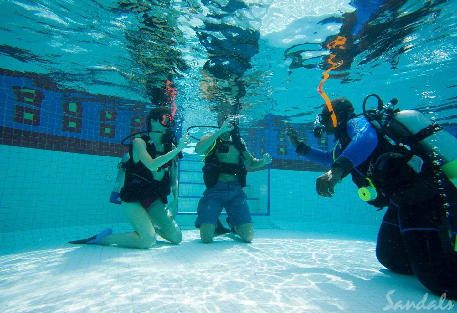two people getting scuba diving instruction