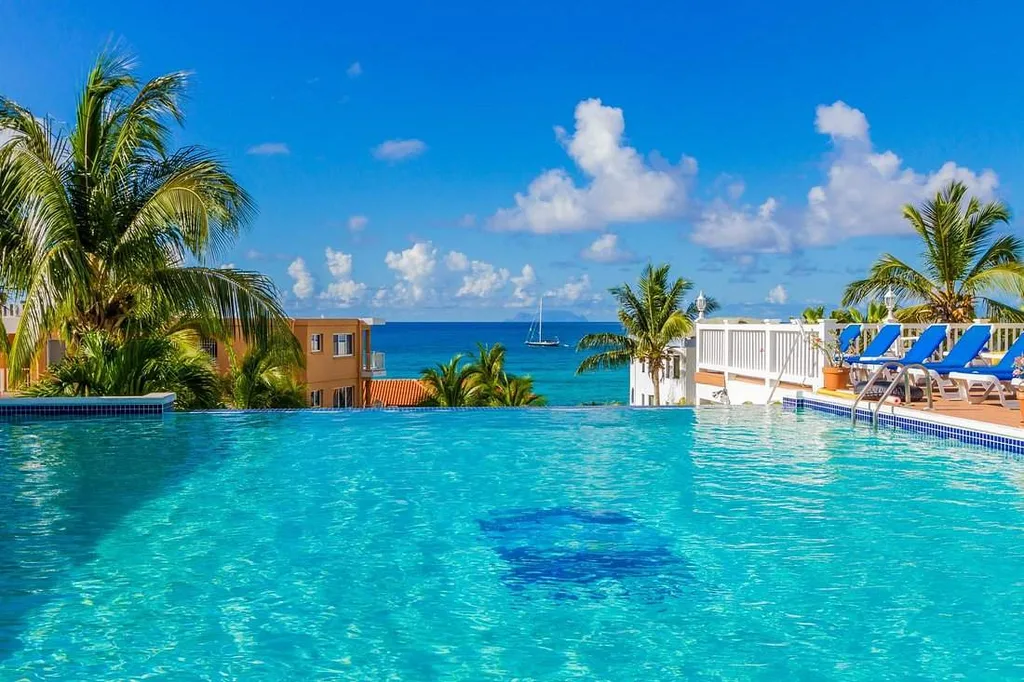 very large resort infinity pool in front of ocean