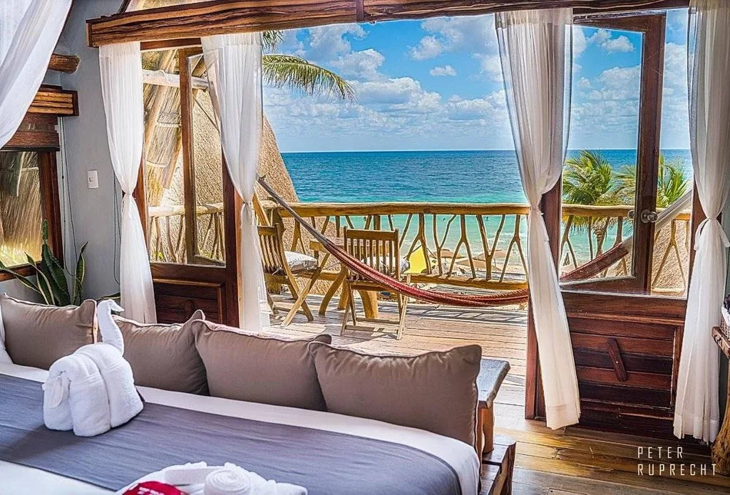 resort room with couch looking out to ocean