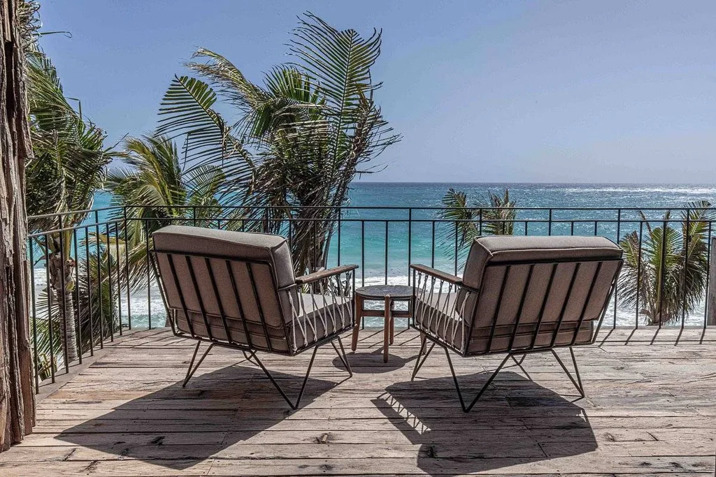 two chairs on patio looking at ocean