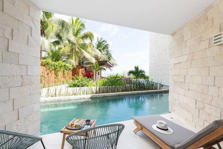 private resort pool with lounge chair