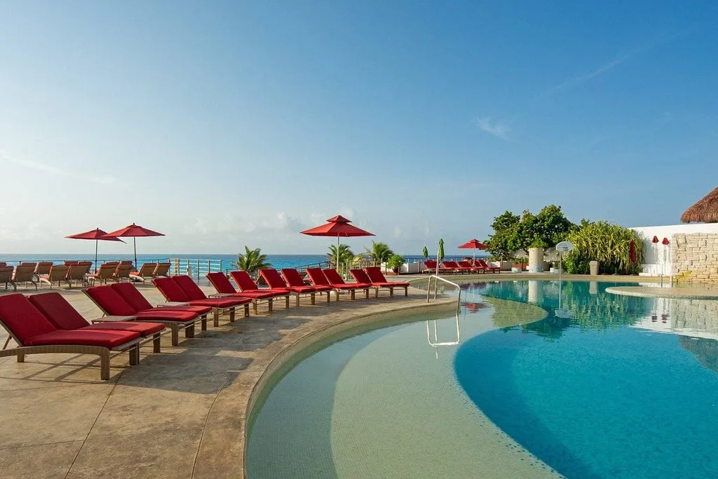 red chairs around resort pool