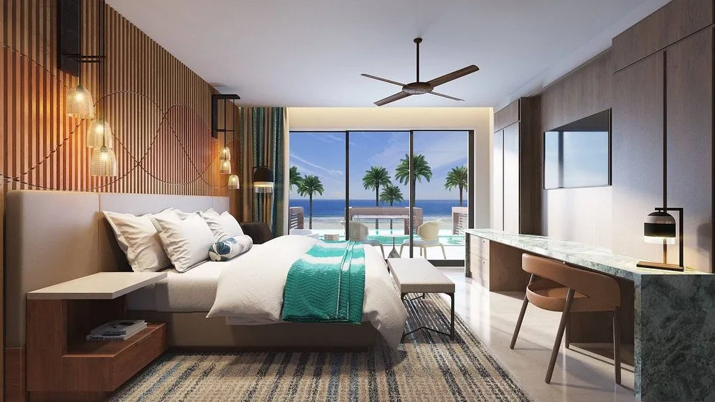 hotel room with palm trees outside the window