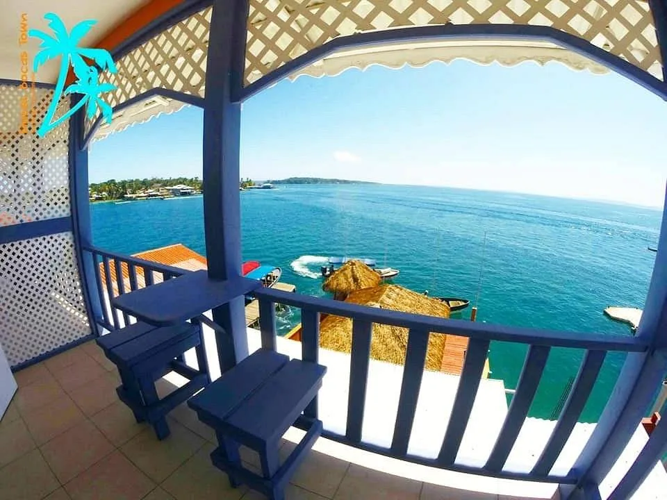 small balcony overlooking ocean