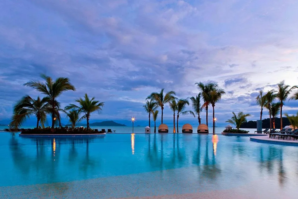 large tropical pool with palm trees